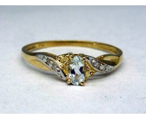 A 9ct gold, topaz and diamond ring, weight 1.0g, size N