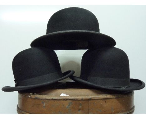 Three bowler hats and a hat tin trunk