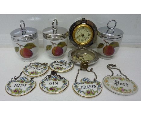 Three Royal Worcester egg coddlers, six spirit labels including Coalport and a novelty Dalvey travel clock