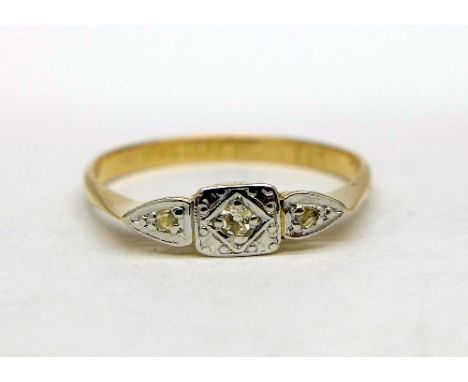 An 18ct gold platinum set three stone diamond ring, weight 1.7g, size O