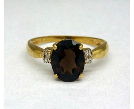 A 9ct gold, smoky quartz and diamond ring, weight 1.3g, size N