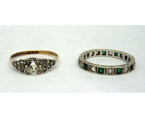 A 9ct white gold eternity ring, two stones missing, 2.9g, size Q and a 9ct gold and silver ring, size Q