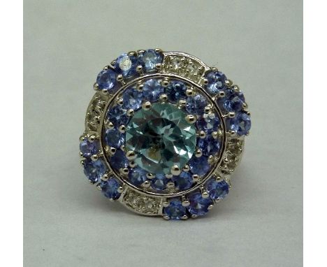 A limited edition silver, tanzanite, sky blue and white topaz ring, weight 6.08g, with certificate