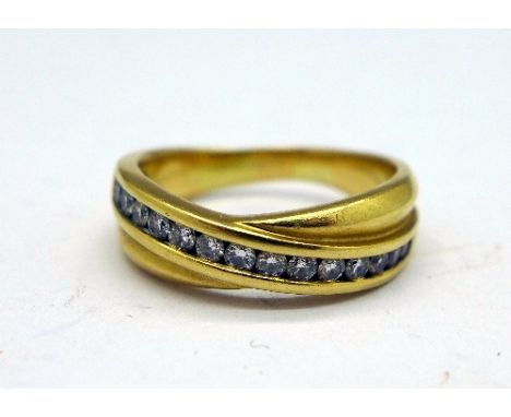 An 18ct gold and diamond half eternity ring, weight 6.7g, size P