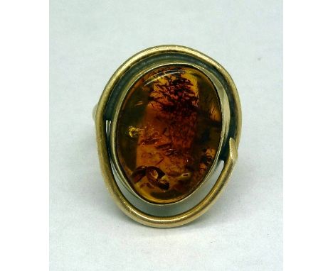 A large silver and amber ring, size P
