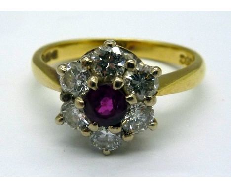 An 18ct gold, diamond and ruby cluster ring, weight 3.9g, size M
