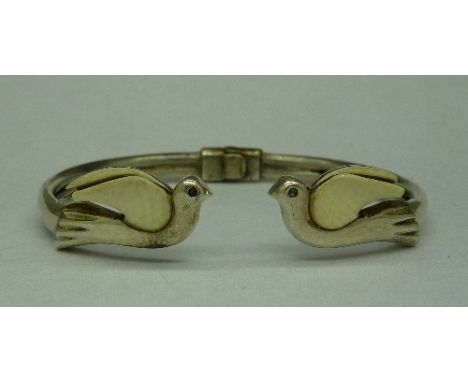 A silver peace bangle with two doves, weight 14g, dove wings a/f