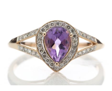 One pear shaped amethyst is surrounded by a halo of round brilliant cut diamonds and a double band of diamonds on the shoulde