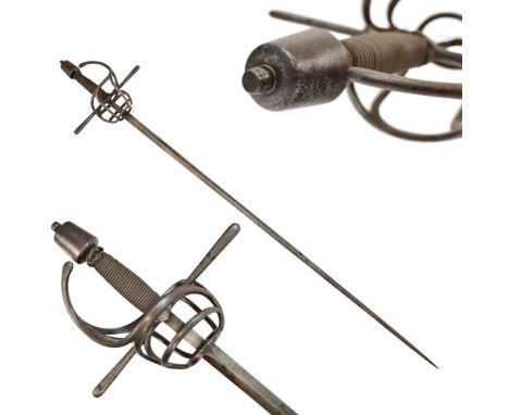 A German Rapier Sword in 17th century style. Straight faceted blade, sharpened on both sides. Forged guard of complex shape. 