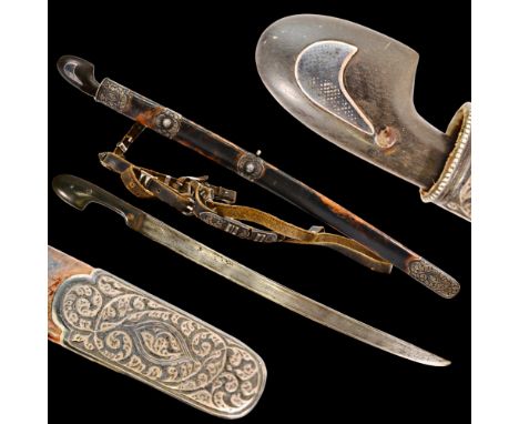 Very rare Children's shashka with belt, Caucasus, Russian Empire, silver and niello, circa 1900. The curved steel blade has o