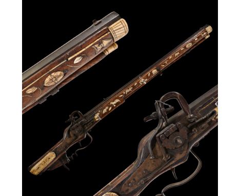 A Superbly bone-inlaid wheellock rifle, Germany, late 17th century. Octagonal barrel, in 18 mm caliber. Wheellock with extern