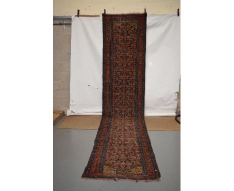 Hamadan runner, north west Persia, circa 1930s, 17ft. 4in. x 3ft. 6in. 5.29m. x 1.07m. Overall wear, heavier in some places; 