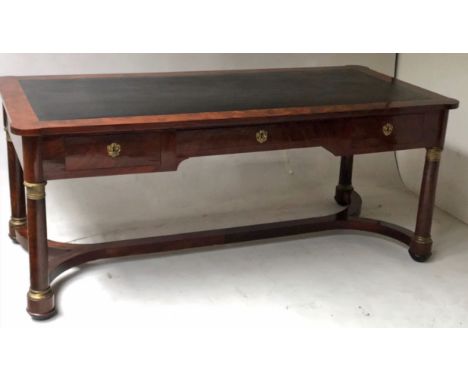 BUREAU PLAT, early 19th century French Empire flame mahogany and gilt metal mounted with tooled leather top above three friez