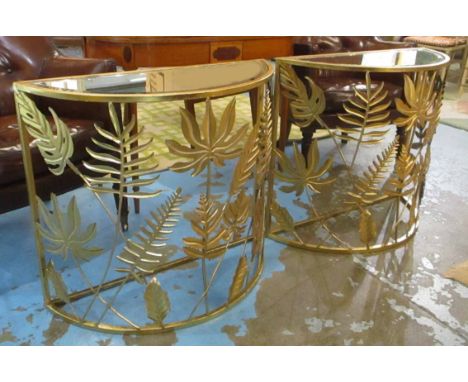 DEMI-LUNE CONSOLE TABLES, a pair, gilt metal framed, each with a bevelled glass top and leaf decoration, 77cm W x 68cm H. (2)