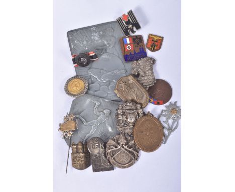 A COLLECTION OF WWI AND WWII GERMAN BADGES, pins and medals, to include a 1909 Langenneufnach badge, a WWII red cross badge, 