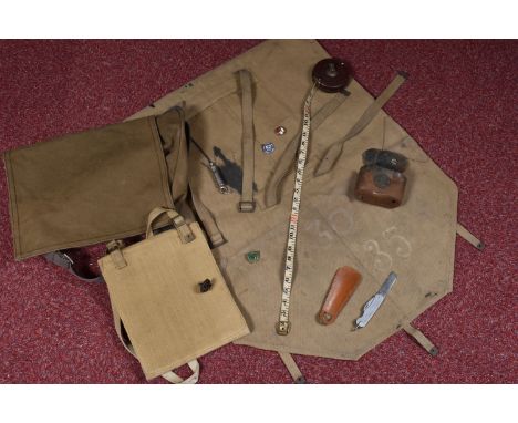 TWO WWII DATED MILITARY BAGS, to include a TANGYE ARP badge, folding knife, tape measure etc, the bags include a 1945 dated m