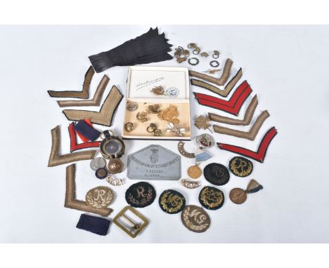 A BOX OF MEDALS, BADGES, BEDPLATE AND COMPASS, to include a DCLI, Duke of Cornwall light infantry bed plate with the name W.C