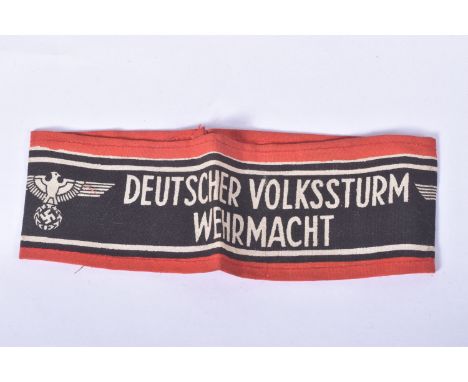 A NAZI GERMANY DEUTSCHER VOLKSSTURM WEHRMACHT ARM BAND, this arm band is genuine and shows the usual uneven overlapping print