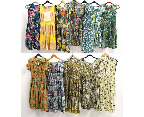 Circa 1950s and Later Cotton Printed Day Dresses, comprising a Peggy Page sleeveless dress printed with classical architectur