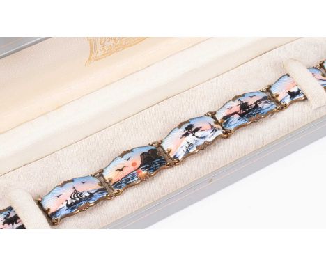 A Norwegian silver-gilt and enamel bracelet Ivan T Holth, the panels depicting Nordic scenes, 18.5cm long, approximately 28gW