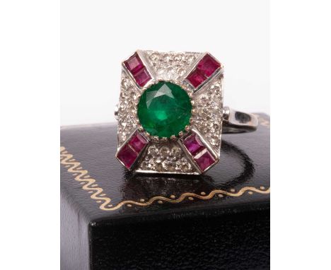 An 18ct white gold, emerald, ruby and diamond ring, the emerald calculated weight 2.08cts, based on estimated dimensions of 8