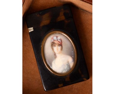 A 19th Century tortoiseshell vesta case with mounted oval ivory miniature of a head and shoulders portrait of a young girl, i