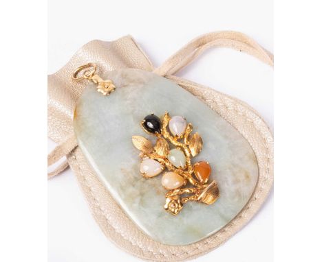 A jade pendant mounted in 14K gold with floral decoration and coloured stones, approximately 6cm long x 4.5cm wide; together 