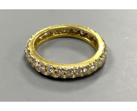 A modern Van Cleef &amp; Arpels 750 yellow metal and two row diamond eternity ring, signed, size K, gross weight 2.7 grams.CO