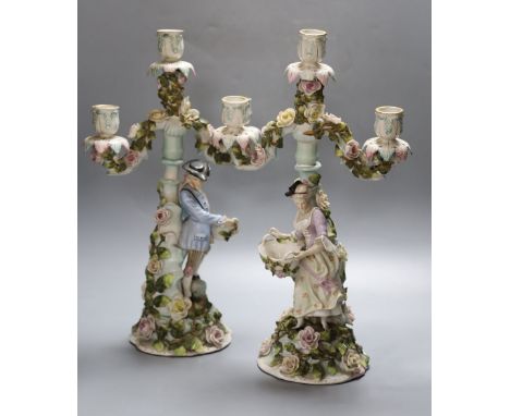 A pair of 19th century Sitzendorf figural candelabra, height 43cmCONDITION: Four of the pendant leaves immediately below the 