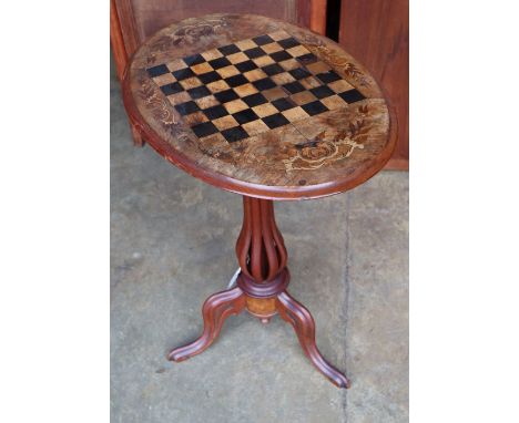 A Victorian inlaid walnut oval tripod games table, width 60cm depth 41cm height 71cm