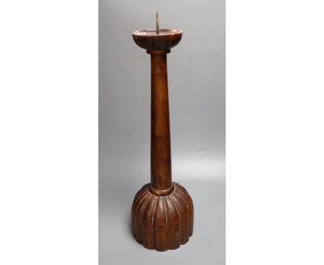 A carved hardwood pricket candlestick, height 58cm