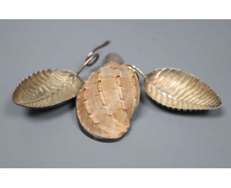 A George III silver leaf caddy spoon, maker, IT, Birmingham, 1798, 71mm and a similar leaf spoon (a.f.) and a mounted shell c