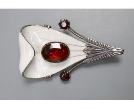 A Scandinavian? parcel gilt white metal, enamel and garnet set stylised leaf brooch, 56mm, gross 27.8 grams.CONDITION: Two sm