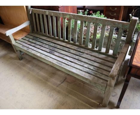 A weathered teak garden bench, length 79cm depth 60cm height 90cm