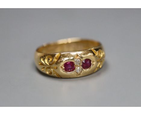 A late Victorian 18ct gold and gypsy set two stone diamond and two stone ruby ring, size K/L, gross 4.4 grams.