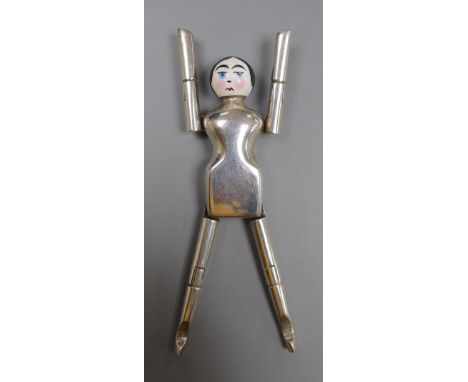A pair of George V novelty silver and enamel sugar nips, modelled as a doll, Cohen &amp; Charles, London, 1925, 91mm.CONDITIO