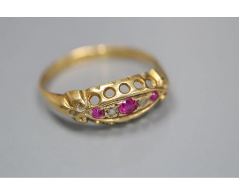 A George V 18ct gold, ruby and diamond chip set ring, size P, gross 2 grams.