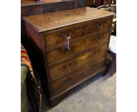 An 18th century oak chest fitted four graduated long drawers on shaped bracket feet, width 97cm depth 50cm height 96cm
