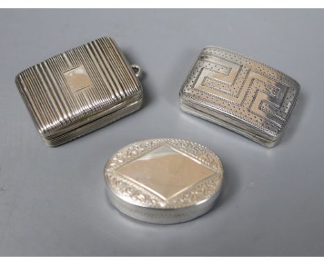 Three George III silver vinaigrettes with gilt interiors, one of engine-turned rectangular form and two with pricked decorati