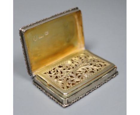 A Victorian silver rectangular vinaigrette, Edward Smith, Birmingham, 1840, 5cm.CONDITION: Tired engraved initials to the cen