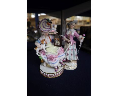 A late Meissen figure of a young girl with a spaniel and another of a young lady with a rose, 19th century, height 14.5cm (fa