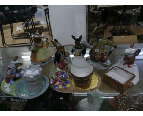 A collection of Royal Doulton Bunnykins tea wares, comprising two teapots, jug, sugar basin, cups and saucers 