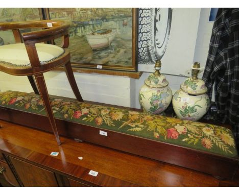 A narrow tapestry covered stool/kneeler 