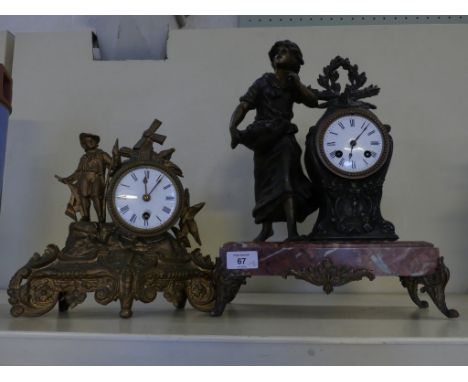 A late 19th Century French mantel clock with figural decoration raised on a red marble marble base together with further smal