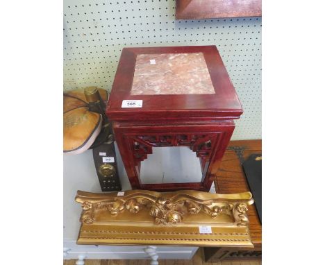 A small Chinese marble topped and red stained occasional table together with a gilt finished wall shelf with carved floral de