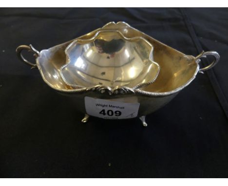 A Continental white metal double handled sugar basin raised on four swept feet, together with a further smaller example, appr