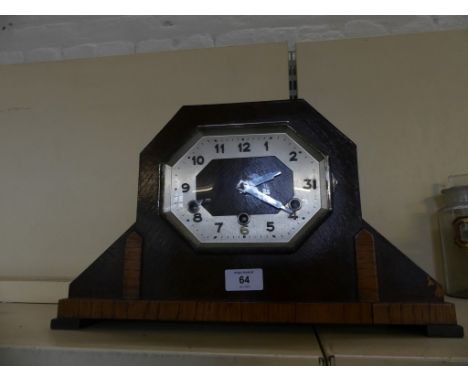 An Art Deco mantel clock in dark stained oak case 