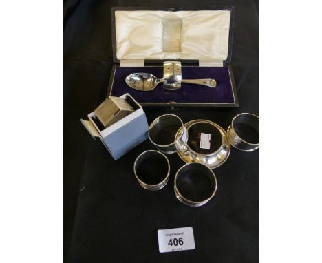 Various silver wares to include a range of various napkin rings, a small silver and mother of pearl dish and a cased christen