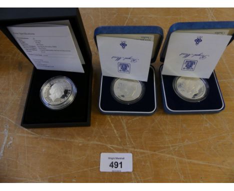 A mixed lot comprising two Queen Elizabeth II Jubilee 2012 gold half crowns, two further silver proof commemorative coins for