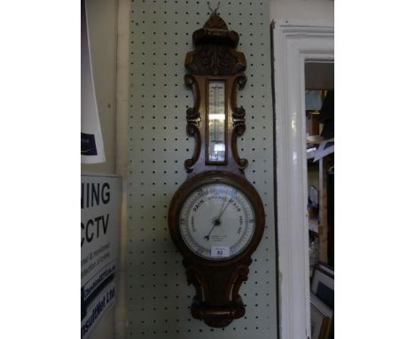 An oak cased aneroid barometer 